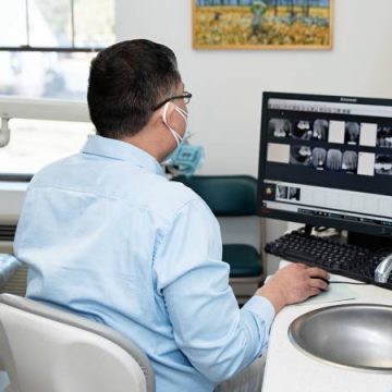 Dr. Jason Arandia, DMD examining patient teeth