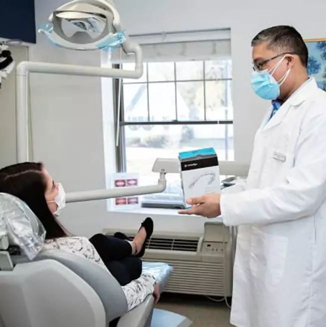 Dr. Jason Arandia, DMD treating patient at Sharon Dental Group